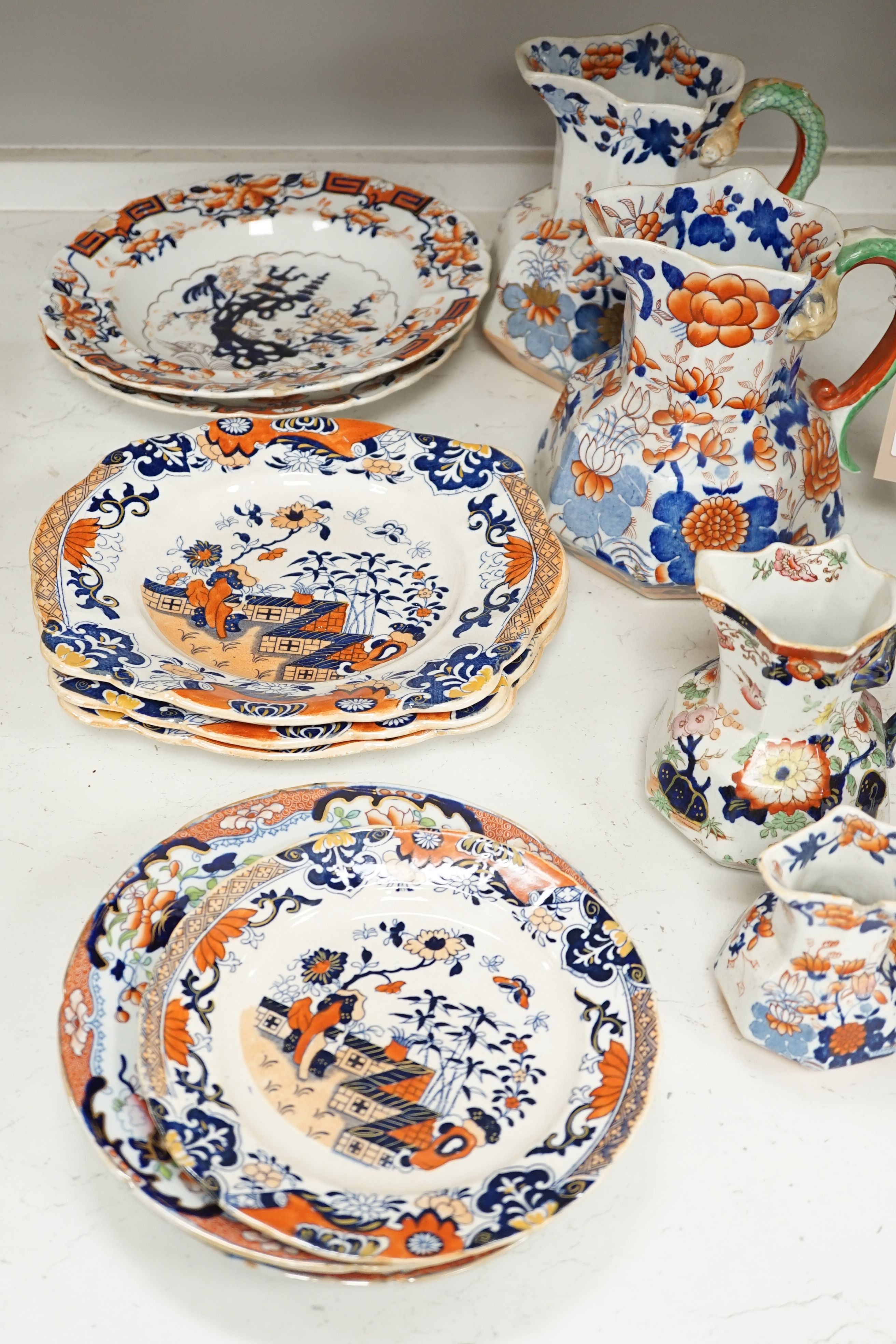 Four graduated Mason’s hydra jugs, tallest 19cm., and eight various ironstone or earthenware plates